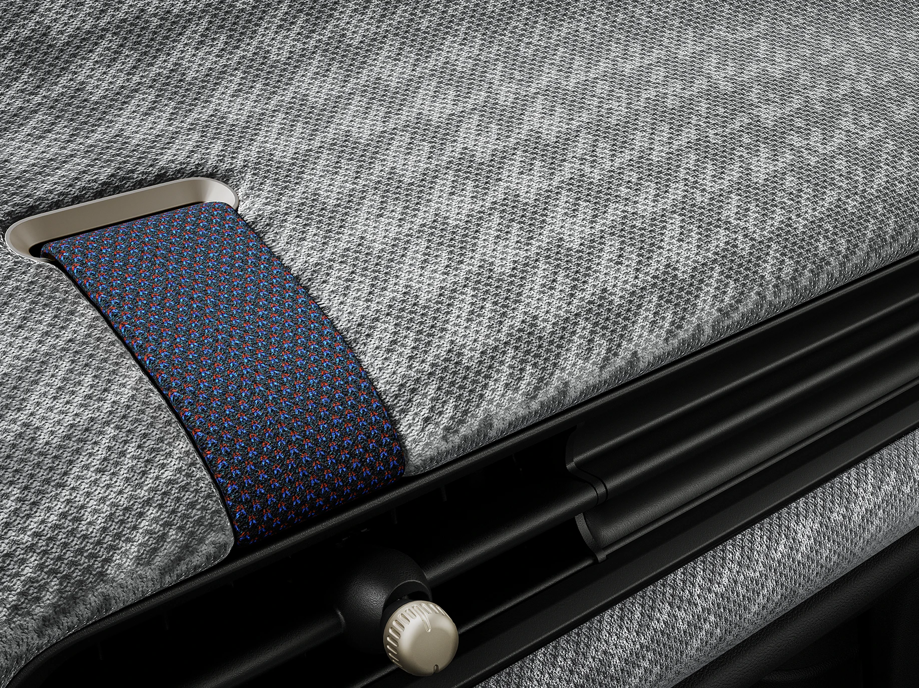 Close-up van het 2D-gebreide dashboard aan de binnenkant van de MINI Cooper.