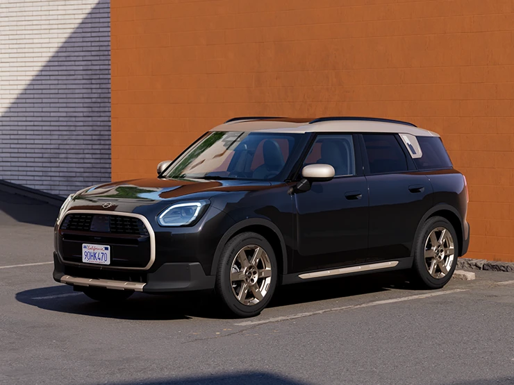Zijaanzicht van de voorkant van de MINI Countryman in Midnight Black met dak in Vibrant Silver.