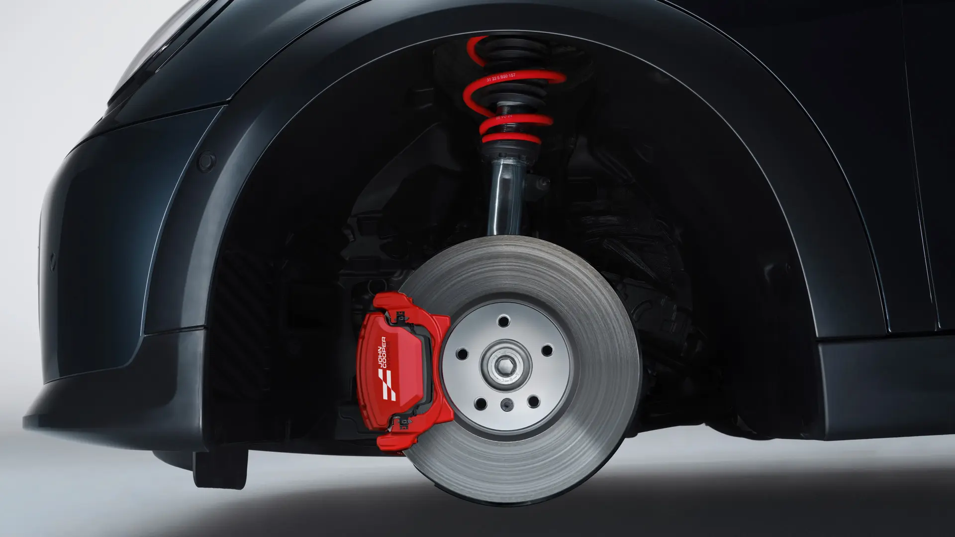 MINI John Cooper Works sportonderstel met veringen in John Cooper Works Chili Red.